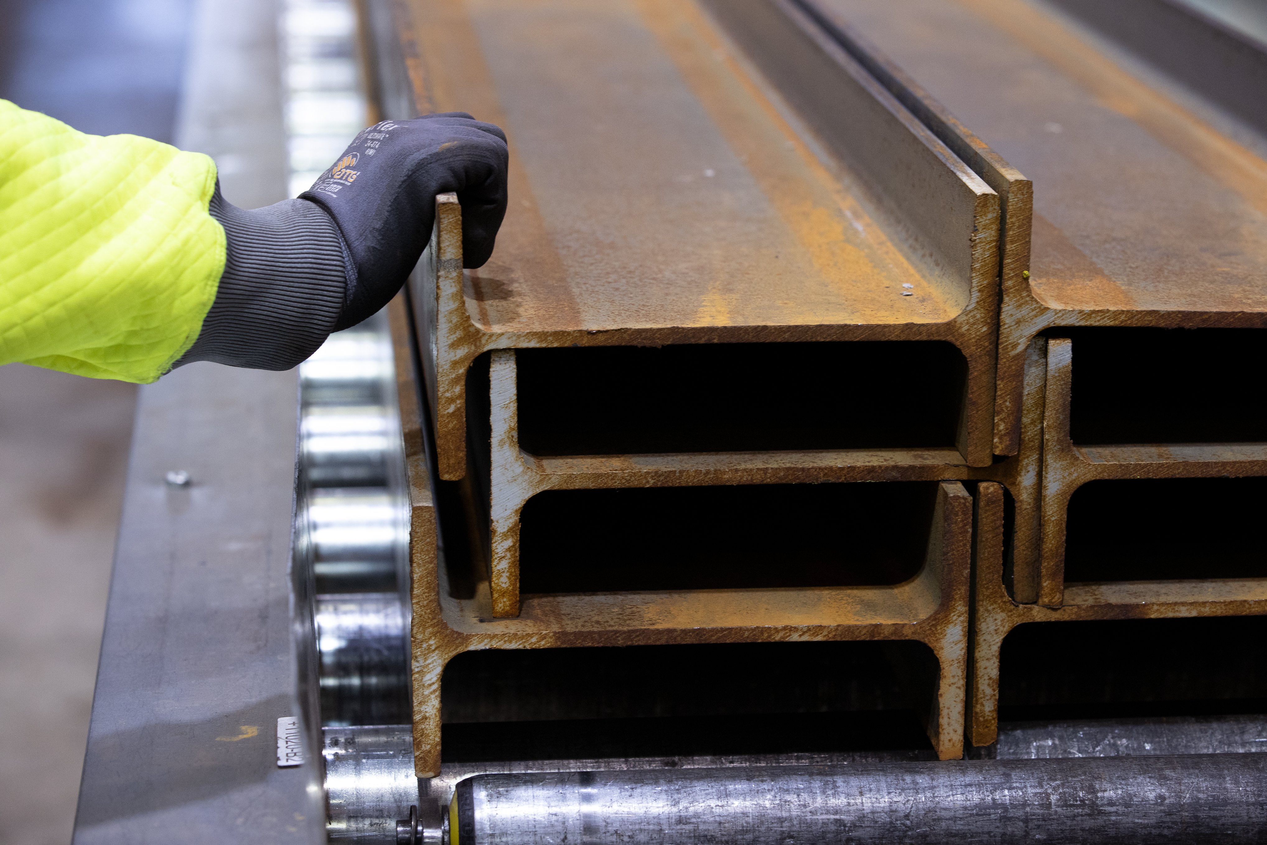 Beams for building structures that are stacked on top of each other