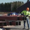 Man with construction helmet working on steel beams